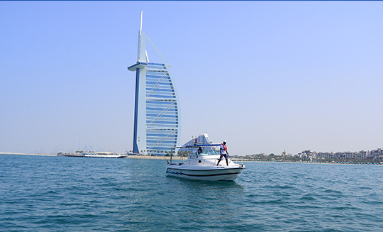 Private boat with Atlantis hotel in background