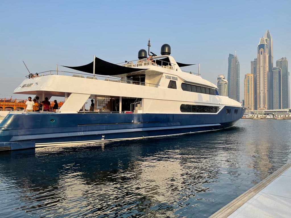 Passengers boarding yacht at Dubai Marina for sunset yacht cruise Dubai with MTS Yachts