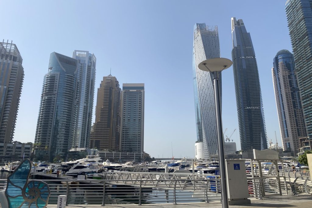 Customer at Dubai Marina Walk before private yacht tour with MTS Yachts Dubai