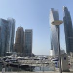 Customer at Dubai Marina Walk before private yacht tour with MTS Yachts Dubai