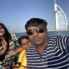 A family capturing a selfie with the Burj Al Arab in the background, enjoying a 2-hour MTS Yachts boat trip in Dubai.